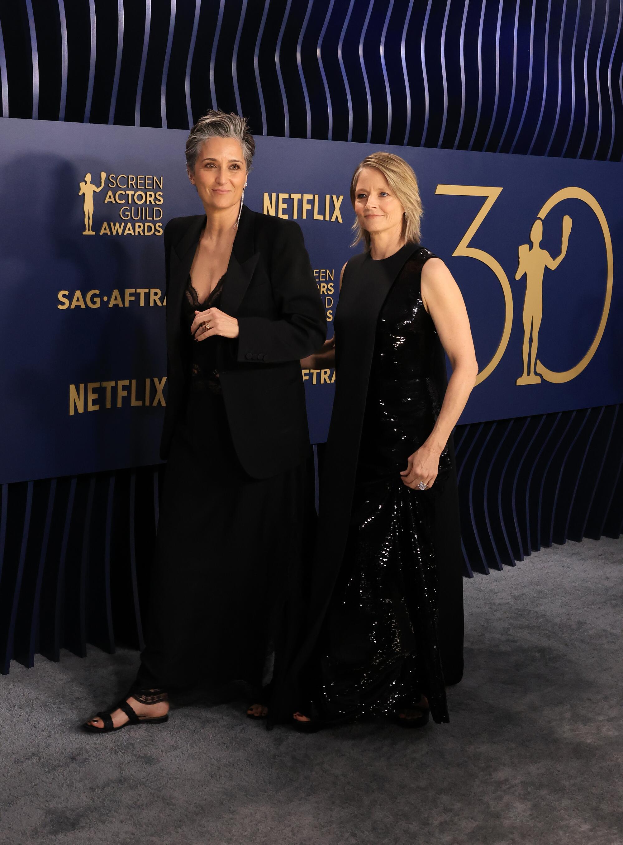 Alexandra Hedison and Jodie Foster wear black at the SAG Awards. 