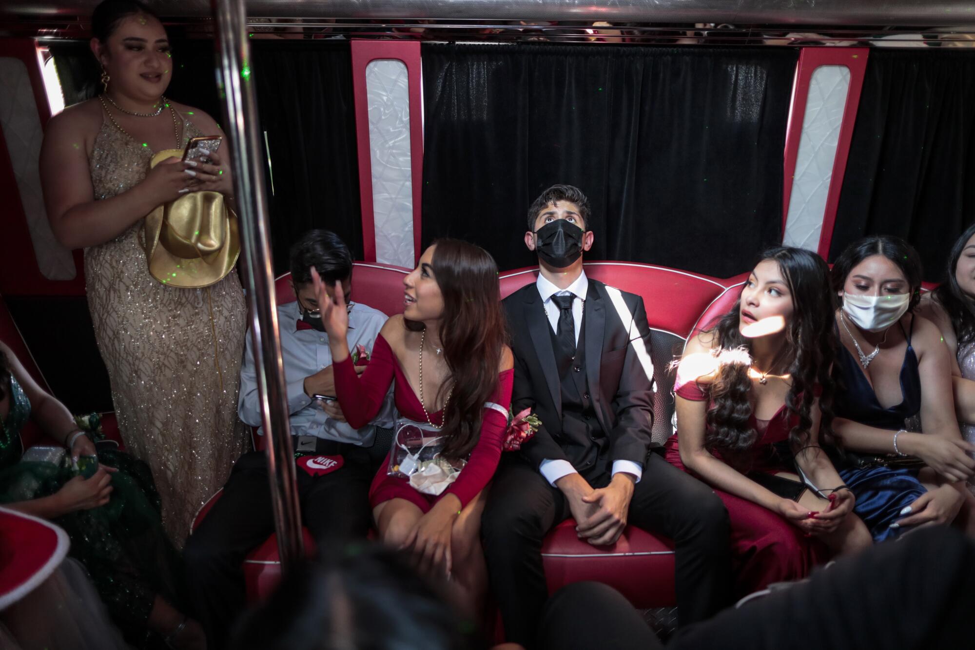 Sierra Vista High senior Eduardo Martinez and others crowd into a party bus