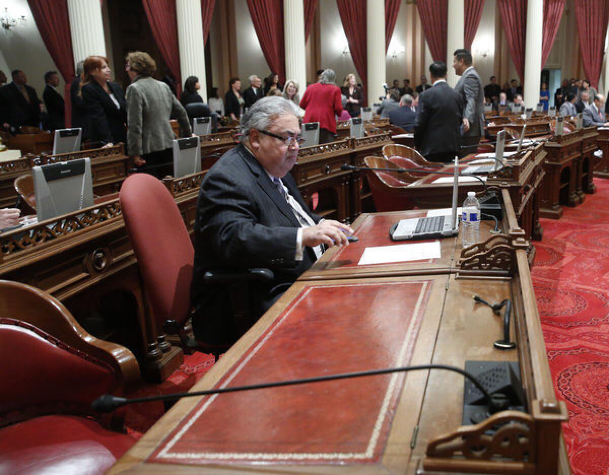State Sen. Ronald S. Calderon (D-Montebello) at his desk in the Capitol.