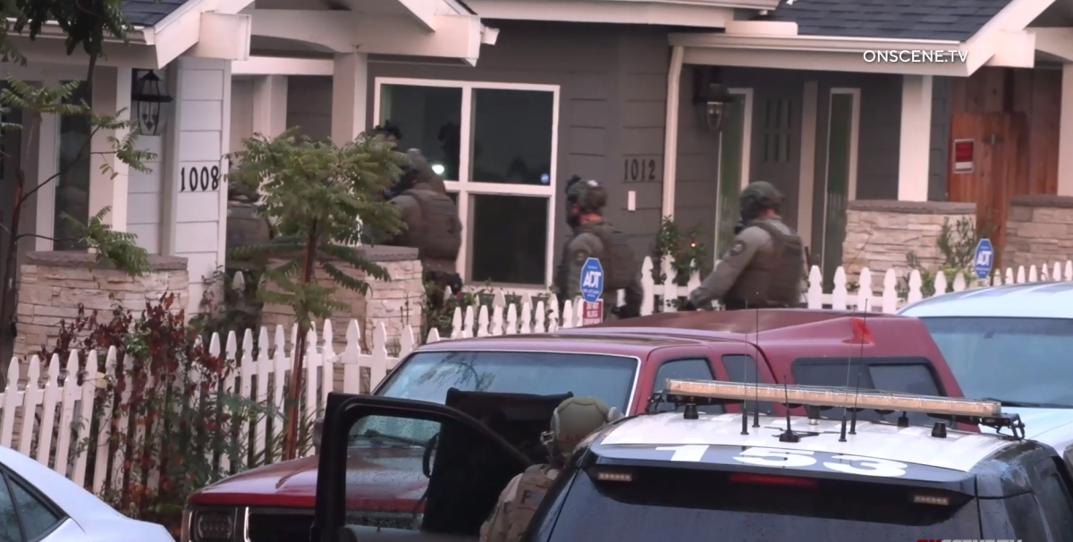 San Diego police set up a perimeter around a Mountain View home Monday.