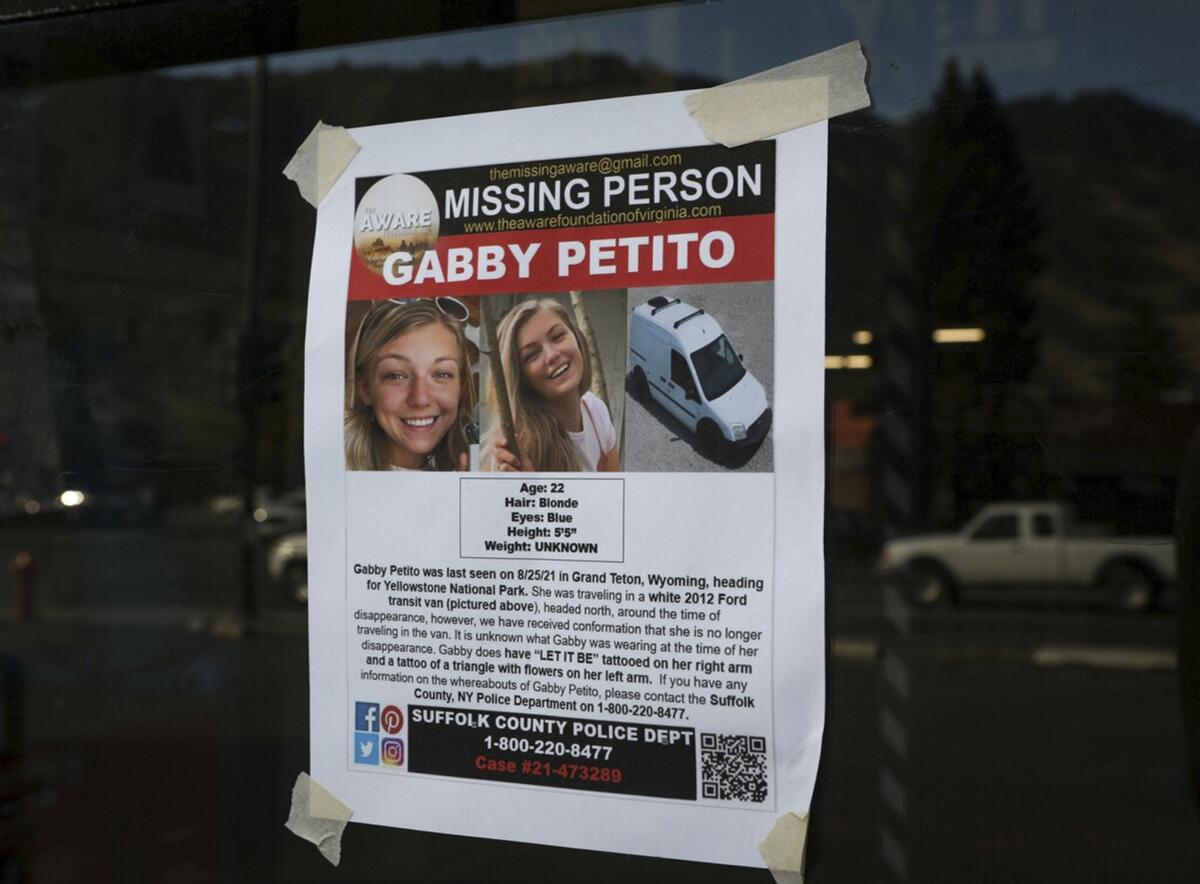 A missing-person poster for Gabby Petito showing photos of a young woman and a white van