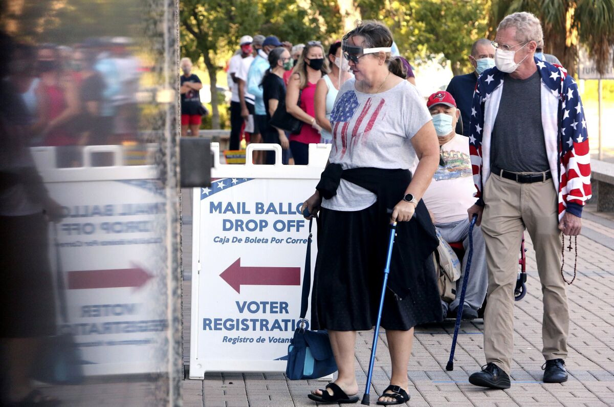 Voters wait in line to vote early in Clearwater, Fla., on Oct. 19.