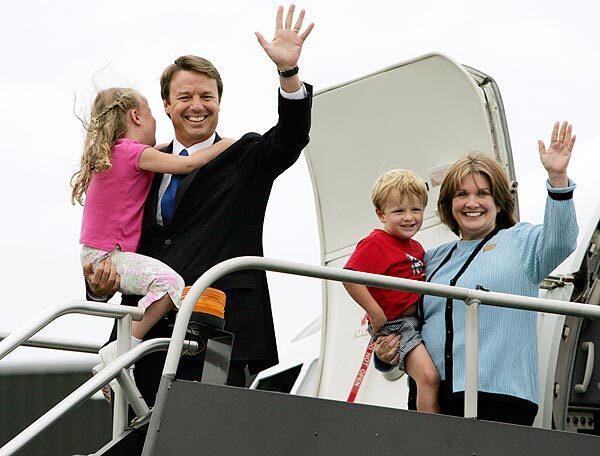 Elizabeth and then-Sen. John Edwards (D-N.C.) depart a campaign plane in 2004 with children Emma Claire, 6, and Jack, 4. See full story