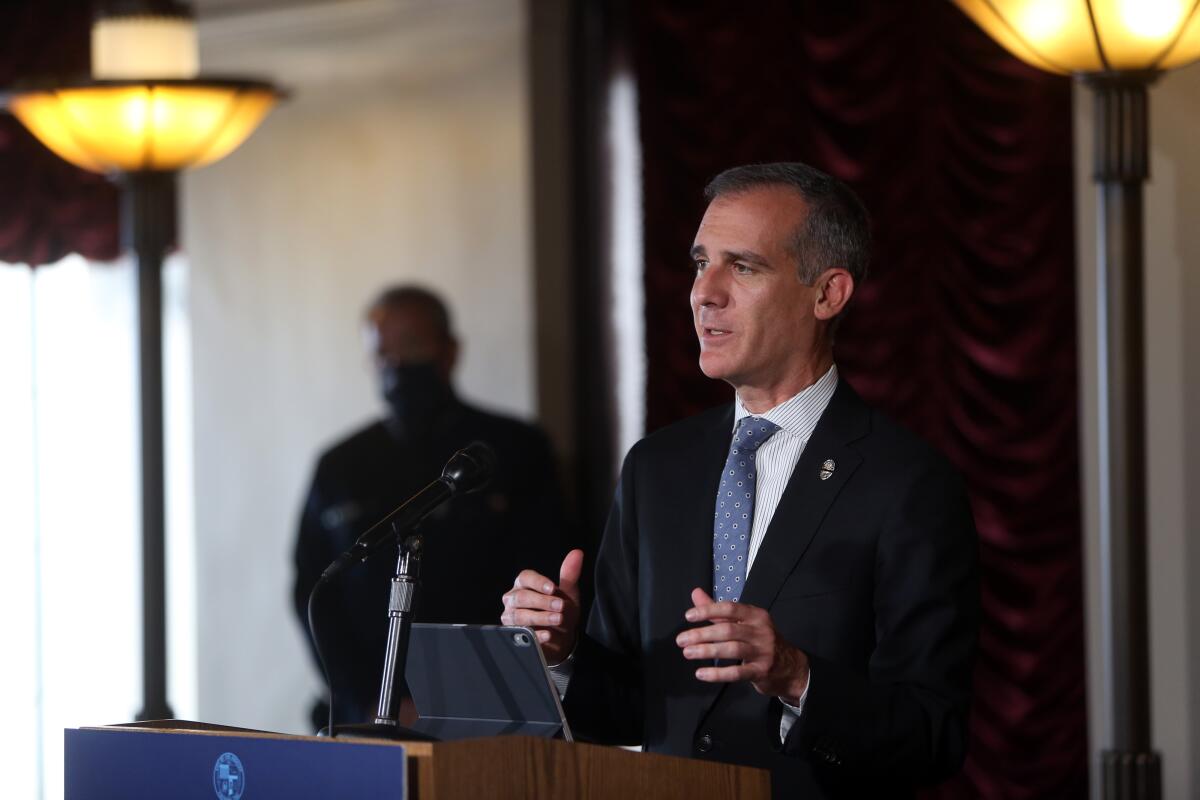 Mayor Eric Garcetti speaks at a lectern