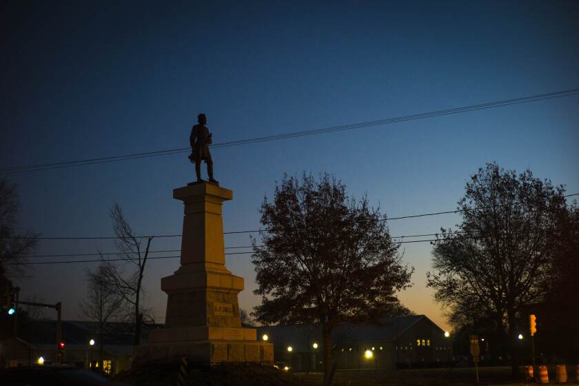 The statue of Confederate Lieutenant General A.P. Hill stands as dawn begins to break on Monday, Dec. 12, 2022 in Richmond, Va. (AP Photo/John C. Clark)