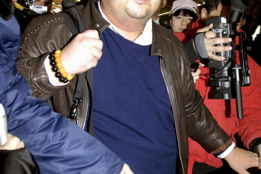 A man believed to be North Korean leader Kim Jong Un's brother, Kim Jong Nam, walks among journalists upon his arrival at the Beijing airport on Feb. 11, 2007.