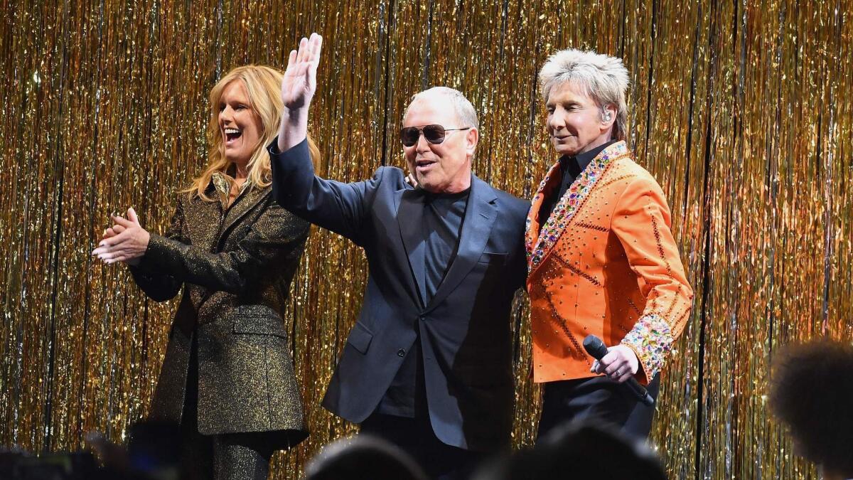 Model Patti Hansen, Michael Kors, center, and Barry Manilow at the finale of the designer's fall and winter 2019 runway collection presentation on Wednesday during New York Fashion Week.