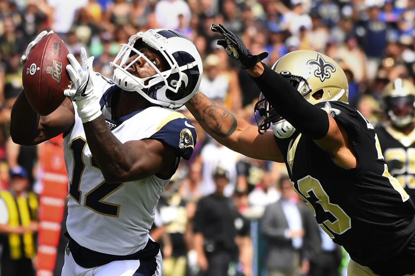 Wally Skalij  Los Angeles Times Rams pass early test Brandin Cooks hauls in a deep pass against New Orleans’ Marshon Lattimore during the Rams’ 27-9 victory in a battle of NFC powers. SPORTS, D1