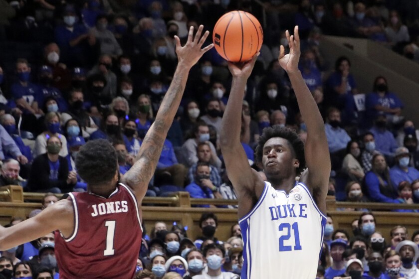 Duke forward A.J. Griffin (21) shoots over South Carolina State guard Cameron Jones (1) during the second half of an NCAA college basketball game Tuesday, Dec. 14, 2021, in Durham, N.C. (AP Photo/Chris Seward)