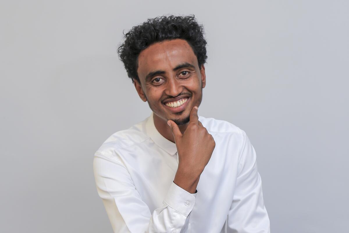 FILE - Freelance video journalist Amir Aman Kiyaro, who is accredited to The Associated Press and has been in detention since November 2021 without charges, poses for a photograph in Ethiopia on Oct. 17, 2021. Ethiopia is being urged on Monday, March 28, 2022, to uphold its international commitments to the freedoms of expression and the press as two lawmakers in the U.S. Congress joined press freedom advocates in calling for the immediate release of Kiyaro. (AP Photo, File)