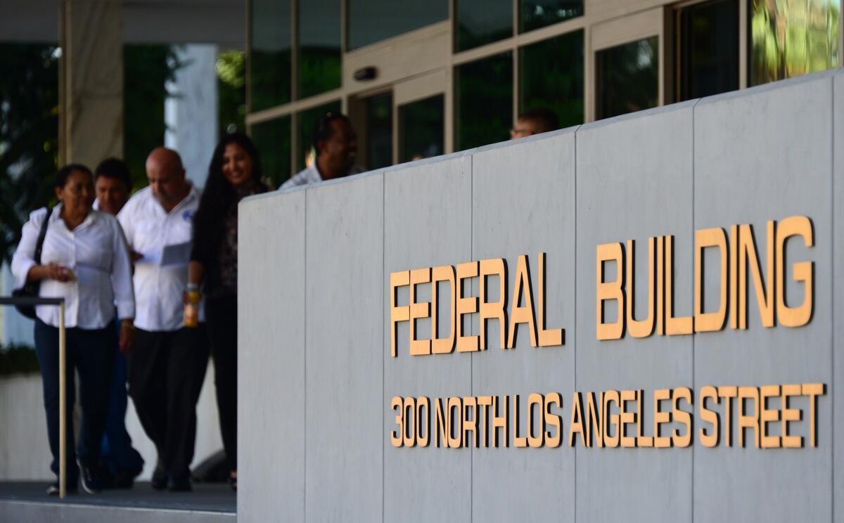 At a federal building in downtown L.A., immigration services remained open, but the IRS office was closed because of the partial government shutdown.