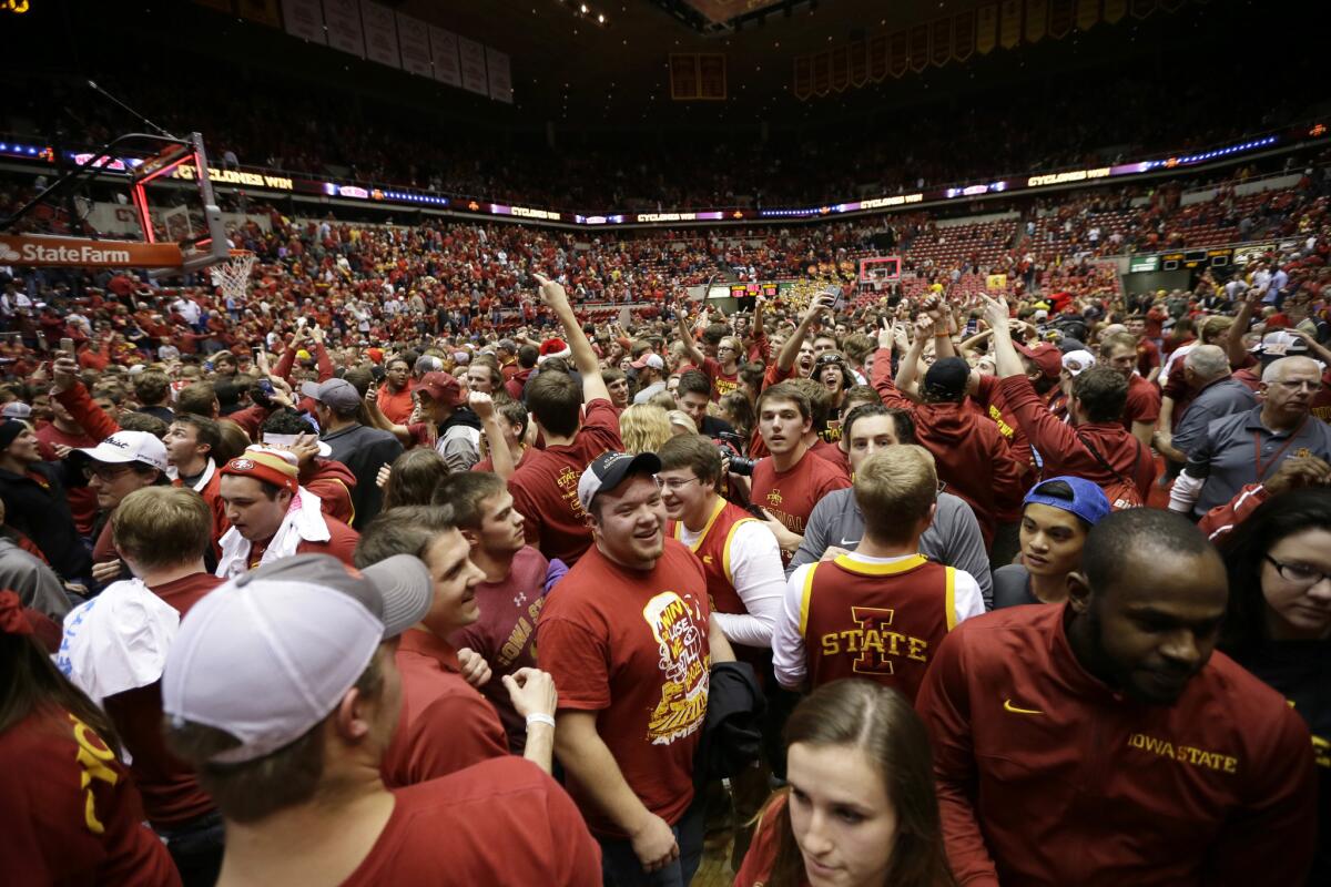 Iowa State fans storm the court after a comeback win over Iowa, 83-82, on Dec. 10.