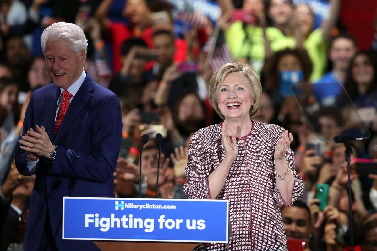 Hillary Clinton celebrates with her husband after winning the New York primary.