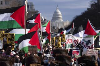 With the U.S Capitol in the background, demonstrators rally during the March on Washington for Gaza at Freedom Plaza in Washington, Saturday, Jan. 13, 2024. (AP Photo/Jose Luis Magana)