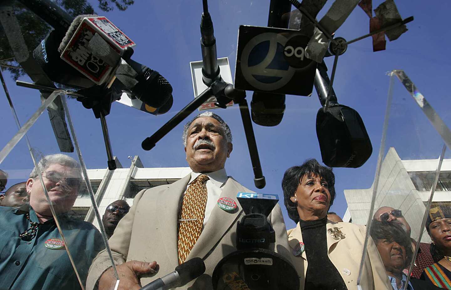 Assemblyman Mervyn Dymally (D-Compton) and Rep. Maxine Waters (D-Los Angeles) stand together in a news conference in 2004.