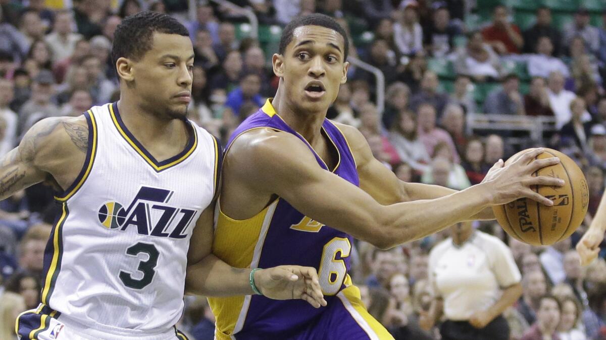 Lakers guard Jordan Clarkson, right, works his way around Utah Jazz guard Trey Burke last season.