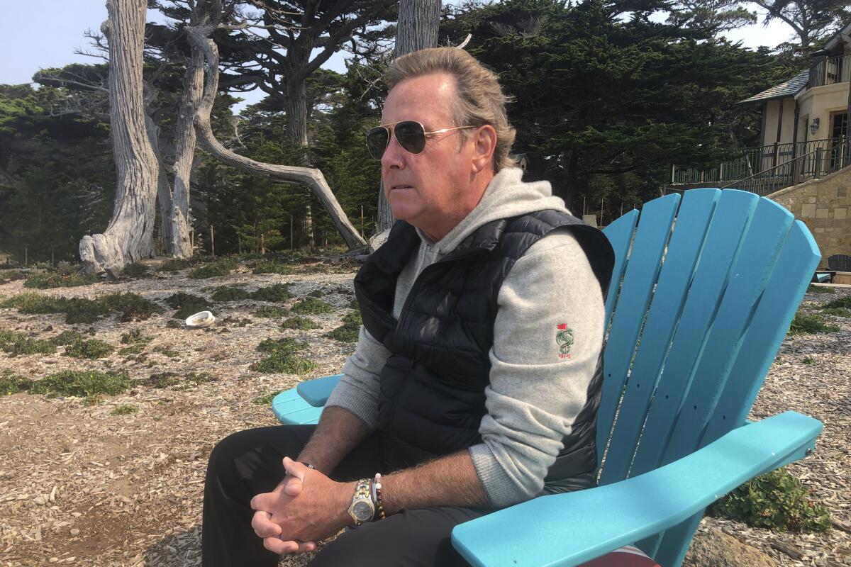 Jack Grandcolas, who lost his pregnant wife on United Flight 93, sits and looks out at the ocean near his home in Pebble Beach, Calif., Aug. 18, 2021. Twenty years later, Grandcolas still remembers waking up at 7:03 that morning. He looked at the clock, then out the window where an image in the sky caught his eye — a fleeting vision that looked like an angel ascending. He didn't know it yet, but that was the moment his life changed. (AP Photo/Haven Daley)