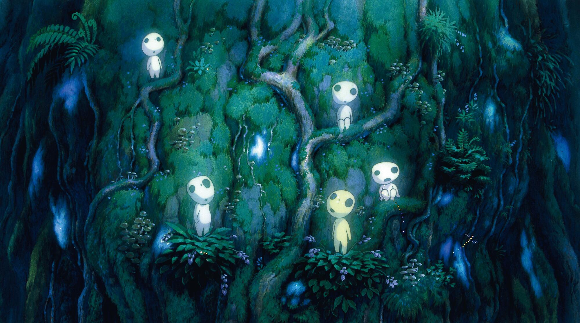 Small forest spirits appear on a large tree in a scene from "Princess Mononoke."