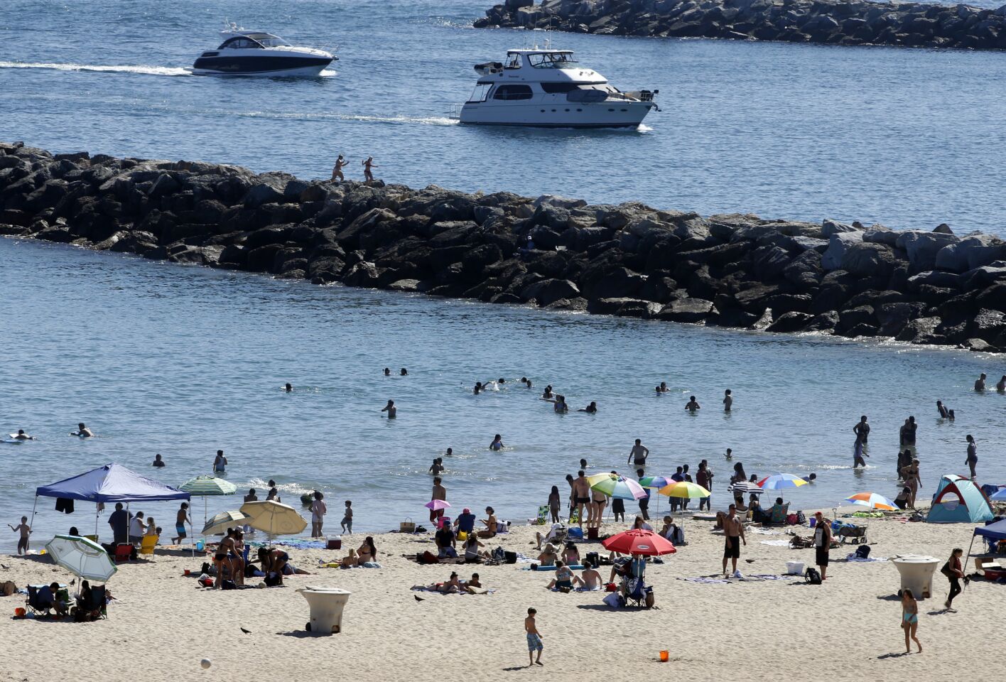 With temperatures soaring into the 90's inland, people flocked to Corona del Mar State Beach to beat the heat.