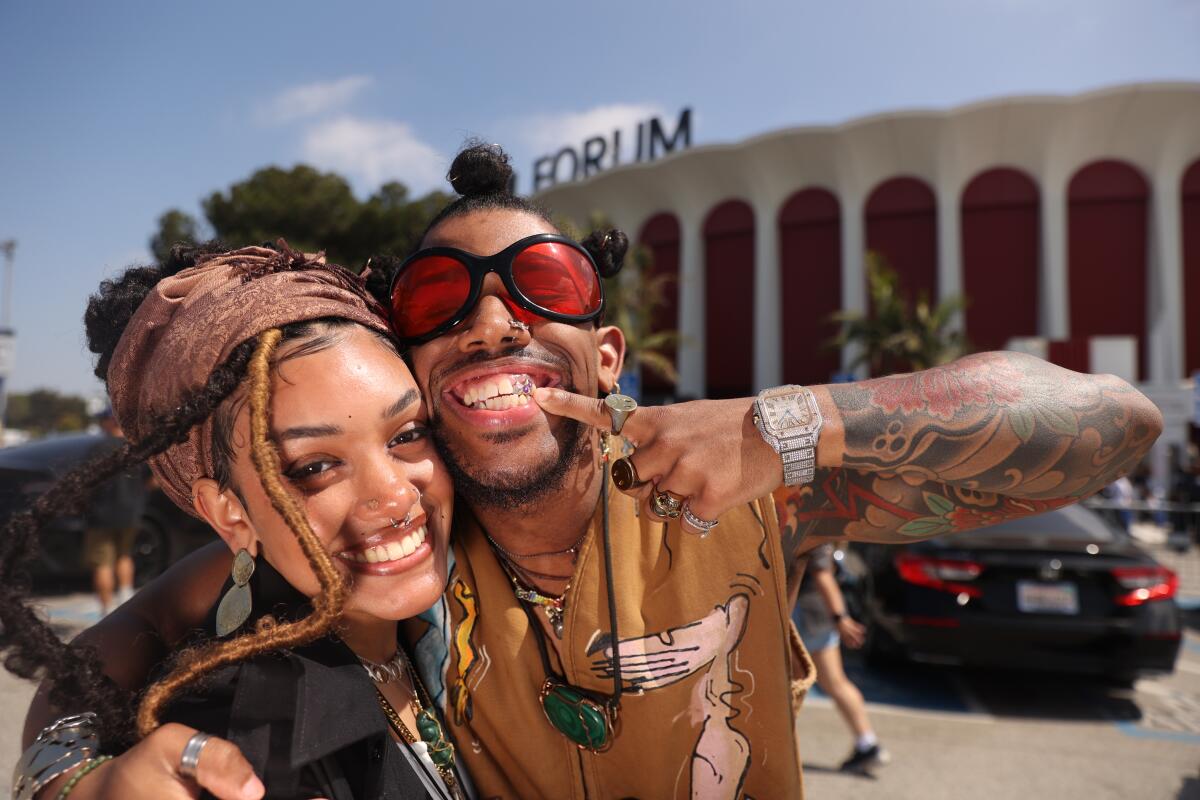 Couple Penélope González, 21 years old, and Johnny "Raydeomundo" Feliz, 26, traveled from New York to attend the show.