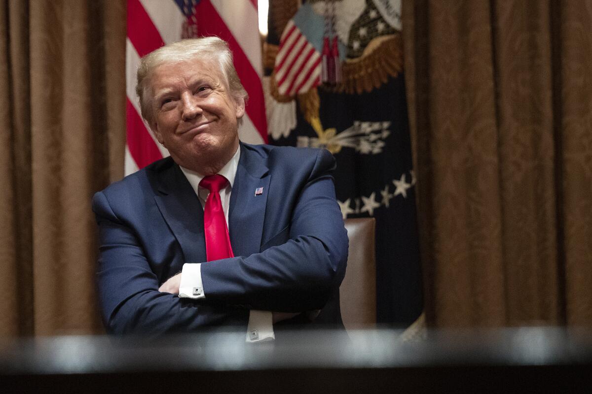 President Trump listens during a roundtable discussion with Black supporters in the White House on Wednesday.