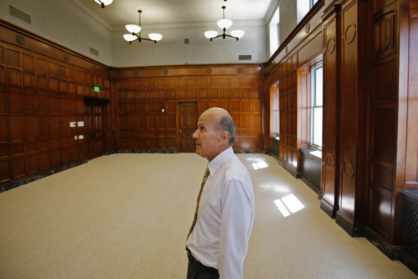 Former Los Angeles County Sheriff Lee Baca admires the craftsmanship in a court chamber on the eight