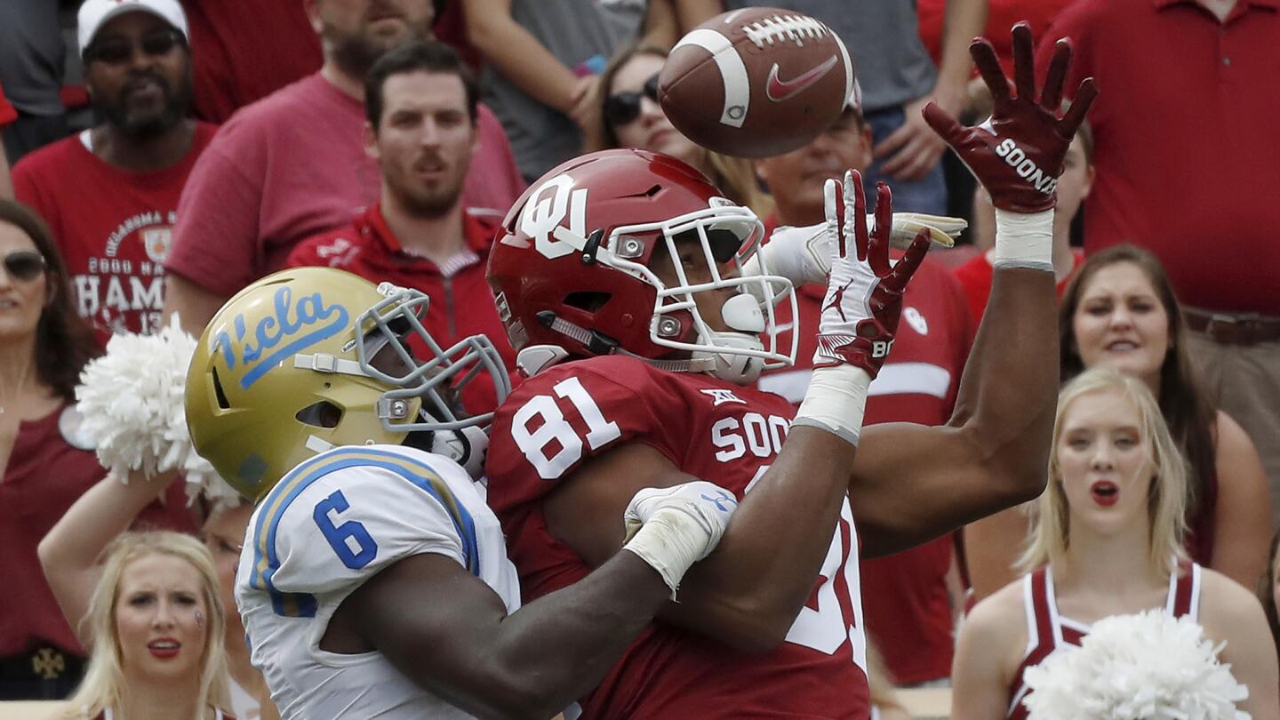 Bruins strong safety Adarius Pickett interferes with Sooners tight end Brayden Willis in the fourth quarter.