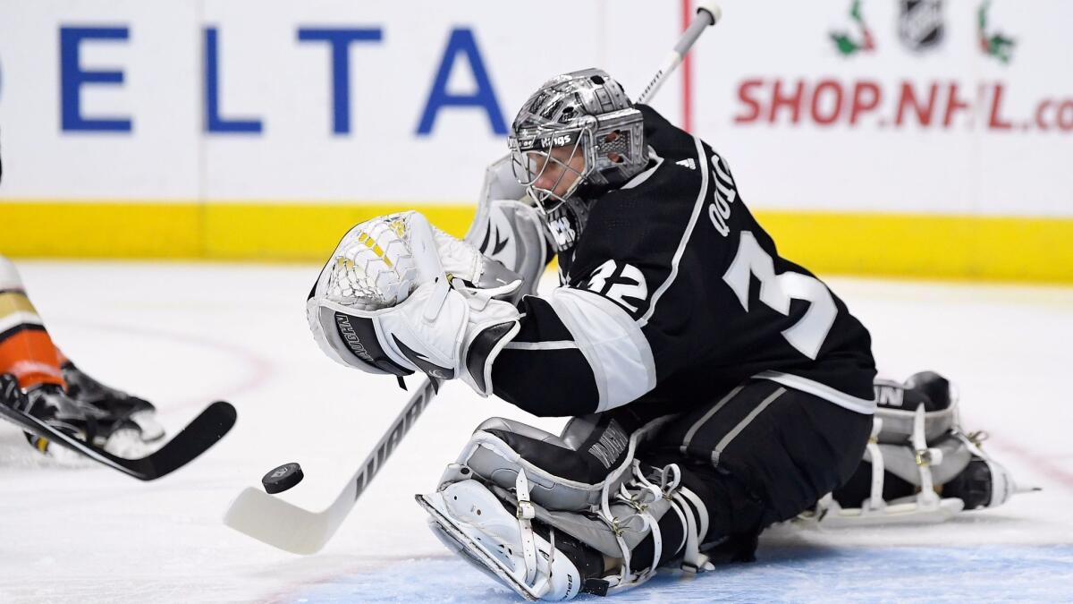 Kings goalie Jonathan Quick stops a shot during the first period against the Ducks on Saturday night.