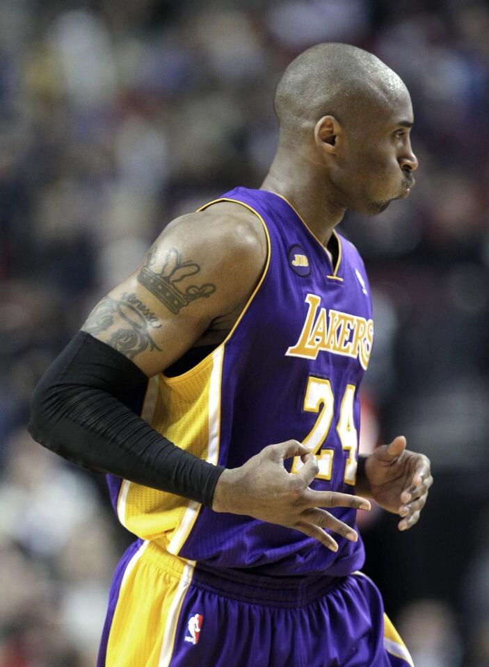 Lakers guard Kobe Bryant reacts after hitting a three-pointer against the Trail Blazers in the second half Wednesday night, when he scored a season-high 47 points in a 113-106 victory at Portland.