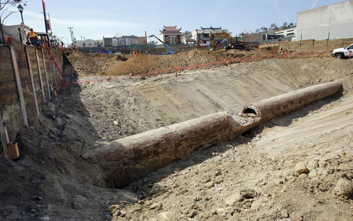 About 73 feet of the Mother Ditch, Los Angeles' first municipal water system, was uncovered by workers excavating the site of a $100-million Chinatown development in the 1200 block of North Spring Street.