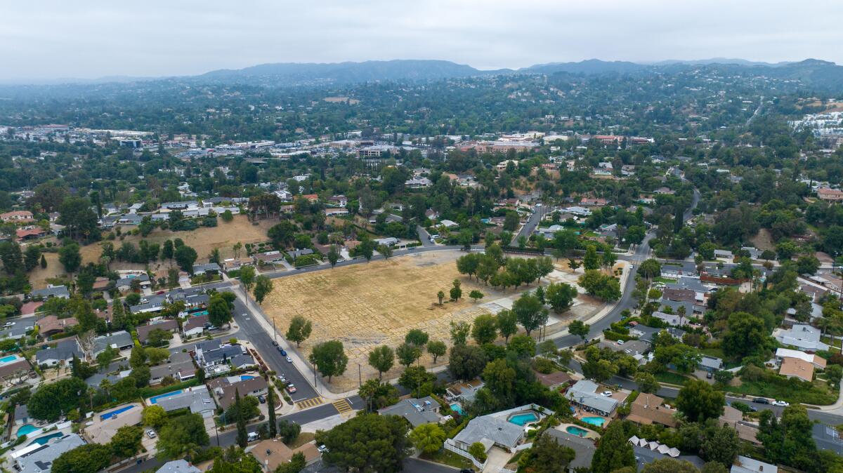 A single-family neighborhood surrounds the vacant site of a closed school in Woodland Hills in 2023.
