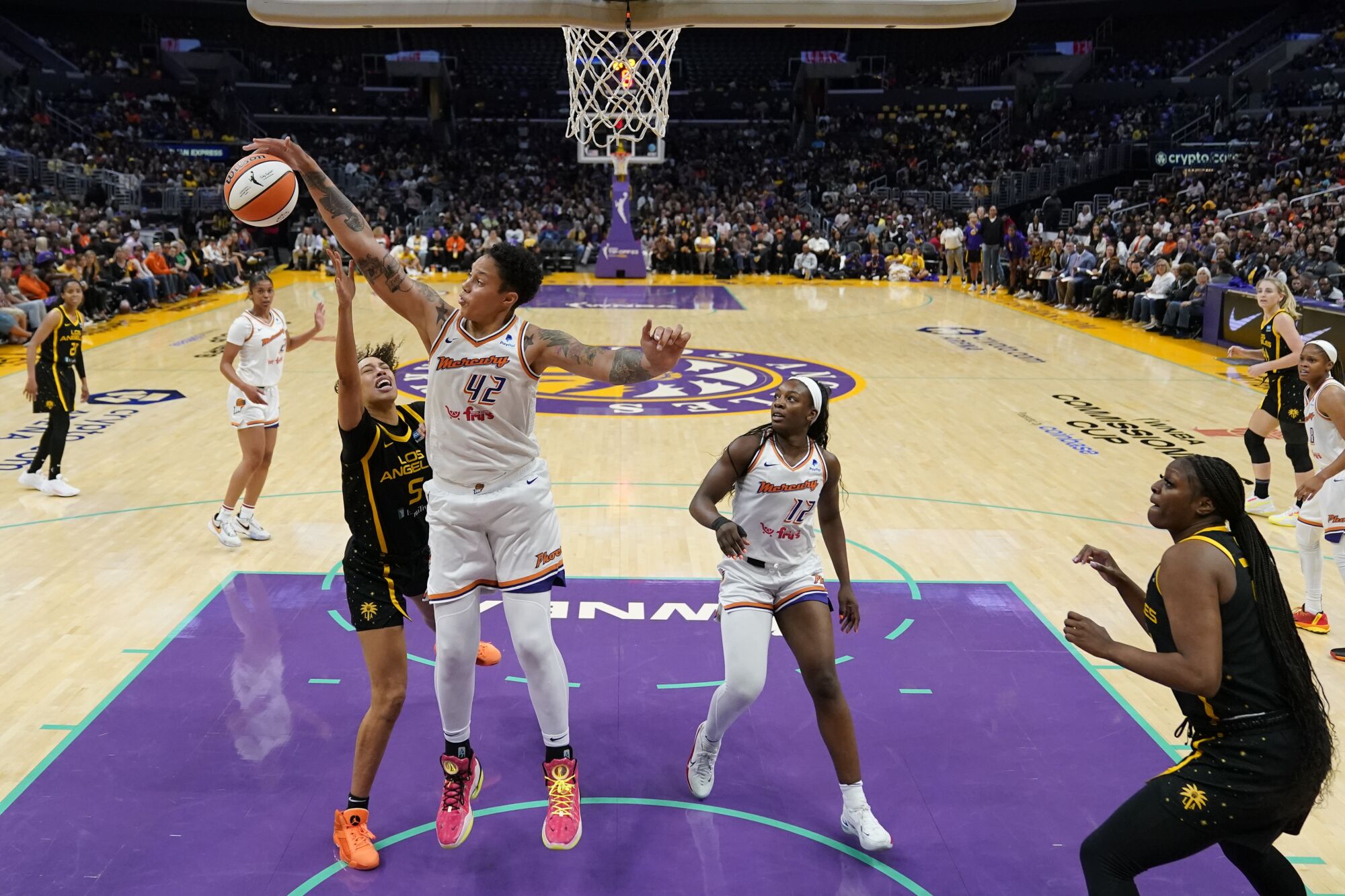 Mercury center Brittney Griner blocks a shot by Sparks guard Dearica Hamby 