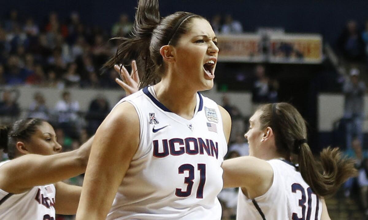 Connecticut center Stefanie Dolson celebrates a basket during the Huskies' 79-58 NCAA women's basketball championship victory over Notre Dame on Tuesday.