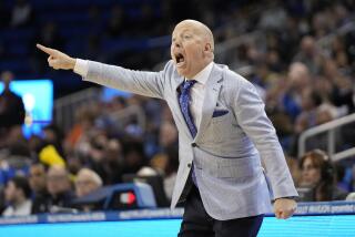 UCLA coach Mick Cronin gestures to his team from the sideline of a game against Oregon State 