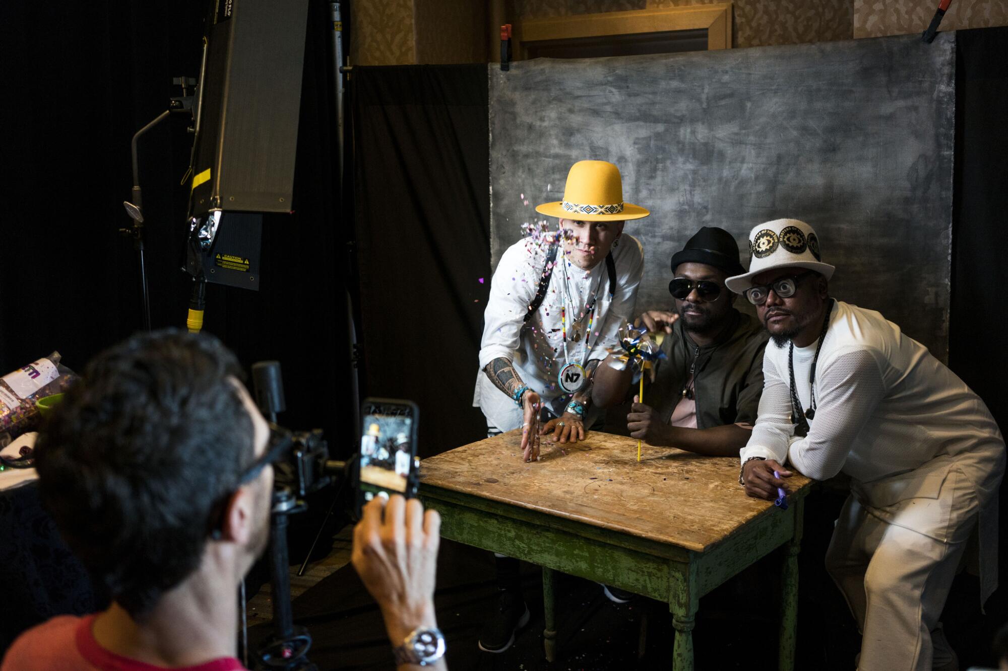 The Black Eyed Peas pose for a photo at San Diego Comic-Con.