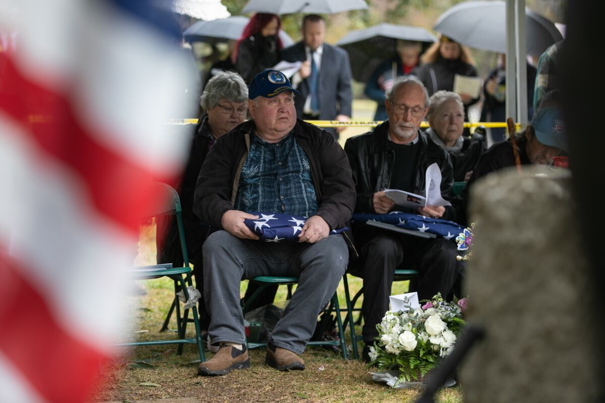 Michael, David and Tim Green attend a ceremony in honor of their late brother Army Pfc. Thomas F. Green.