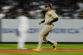 San Diego Padres' Juan Soto runs to second base for a double during the ninth inning of a baseball game against the New York Yankees, Friday, May 26, 2023, in New York. (AP Photo/Frank Franklin II)