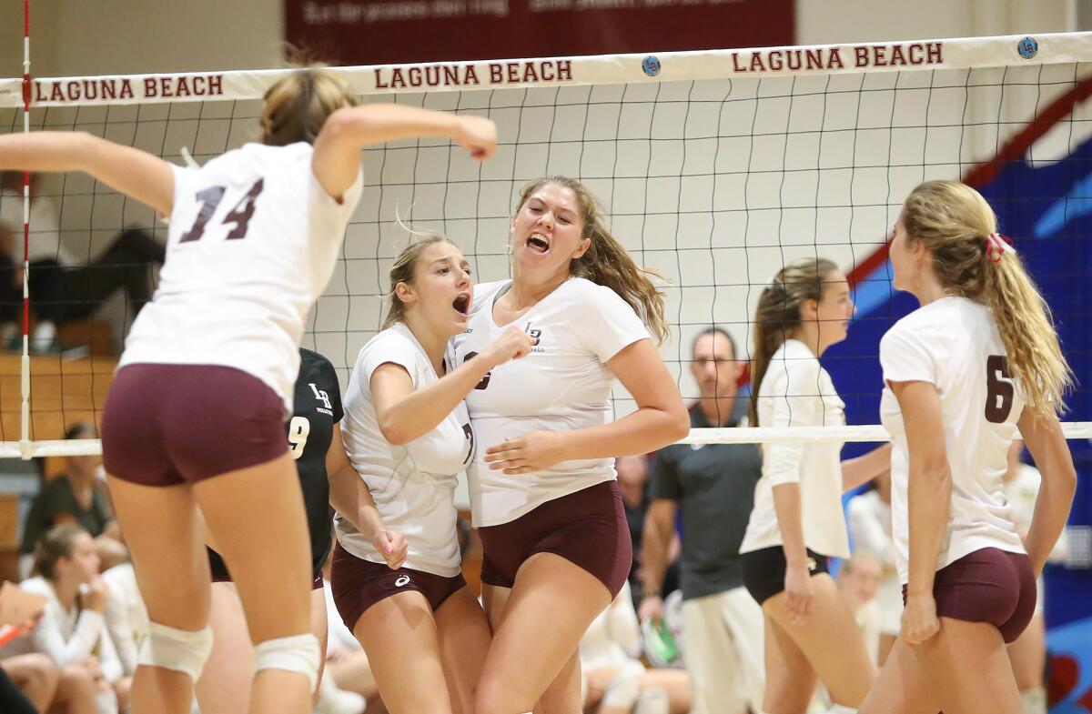 Laguna Beach celebrates a point in the first round of the CIF Southern Section Division 1 playoffs against Mira Costa on Thursday.