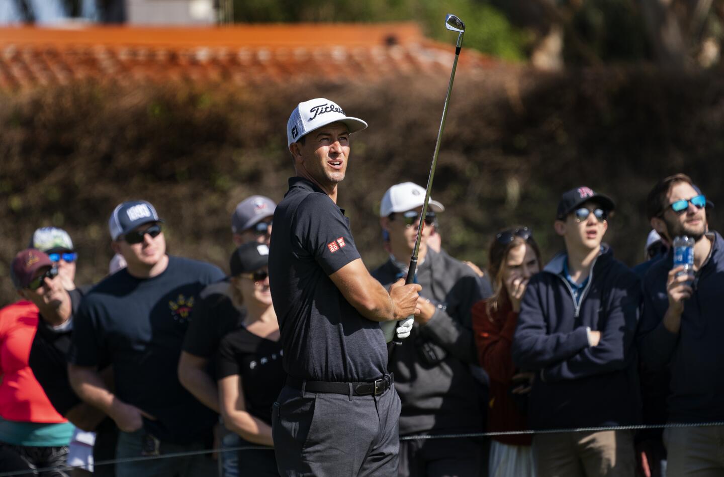 Adam Scott watches hits from the 14th tee during the third round of the Genesis Invitational at Riviera Country Club on Feb. 15, 2020.