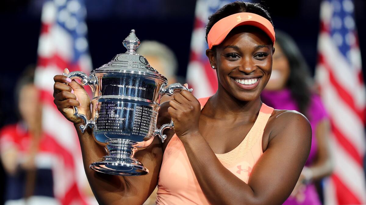 Sloane Stephens poses with the championship trophy after she defeated fellow American Madison Keys in the U.S. Open women's final on Saturday.