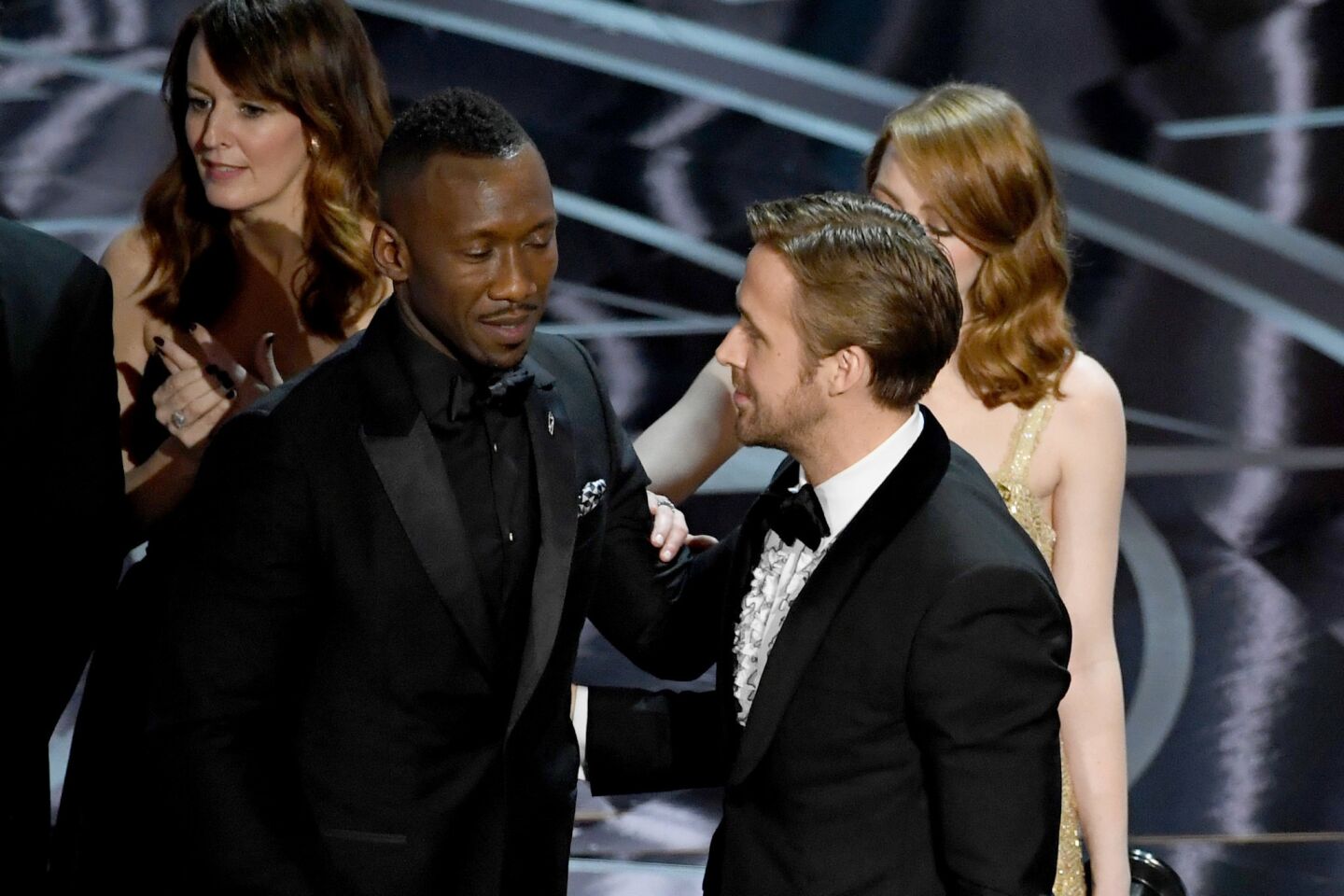 "Moonlight" actor Mahershala Ali, left, with Ryan Gosling and Emma Stone after it was discovered that "La La Land" was mistakenly announced as best picture onstage.