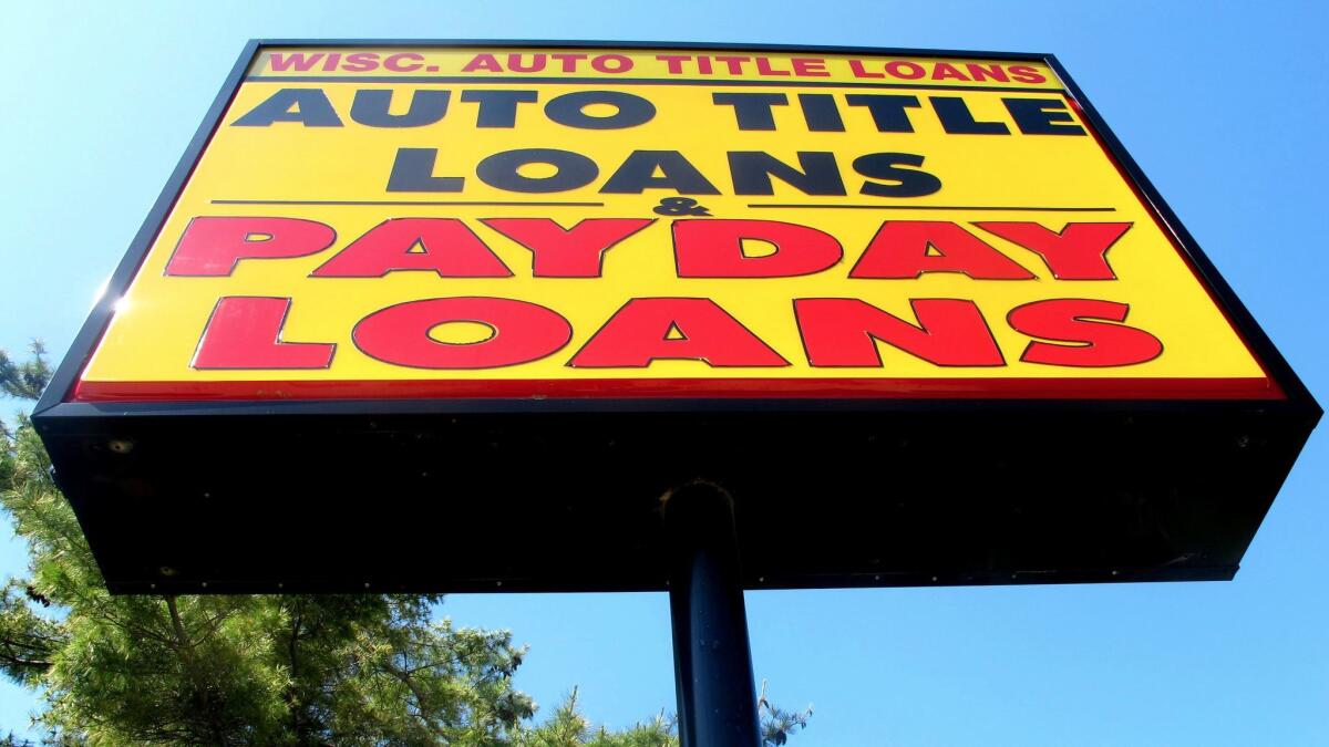 A sign for a Wisconsin Auto Title Loans store is seen in Madison, Wis.