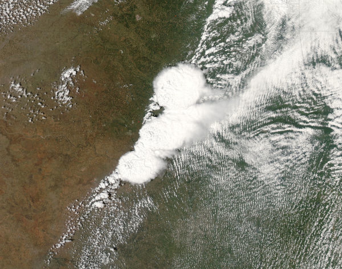 NASA's MODIS satellite captures the storm system that generated a EF4 tornado -- distinguished by the thick cord of clouds at the center -- as it hit Moore, Okla.
