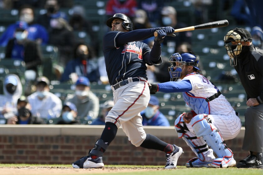 Atlanta Braves' Sean Kazmar Jr. bats during the fifth inning of a baseball game against the Chicago Cubs, Saturday, April 17, 2021, in Chicago. Kazmar Jr. returned to the major leagues after an 13-year absence, pinch hitting for the Braves. (AP Photo/Paul Beaty)