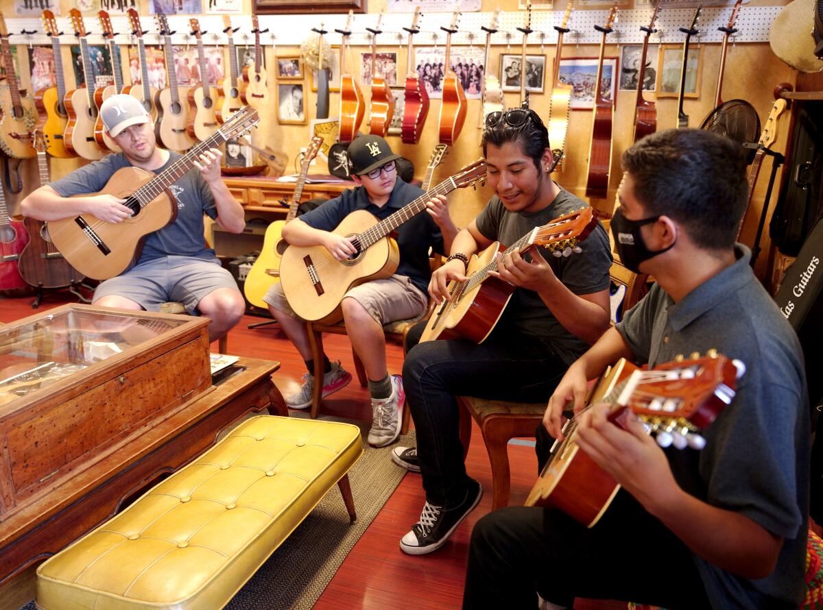 People practice at Candelas Guitars in East Los Angeles