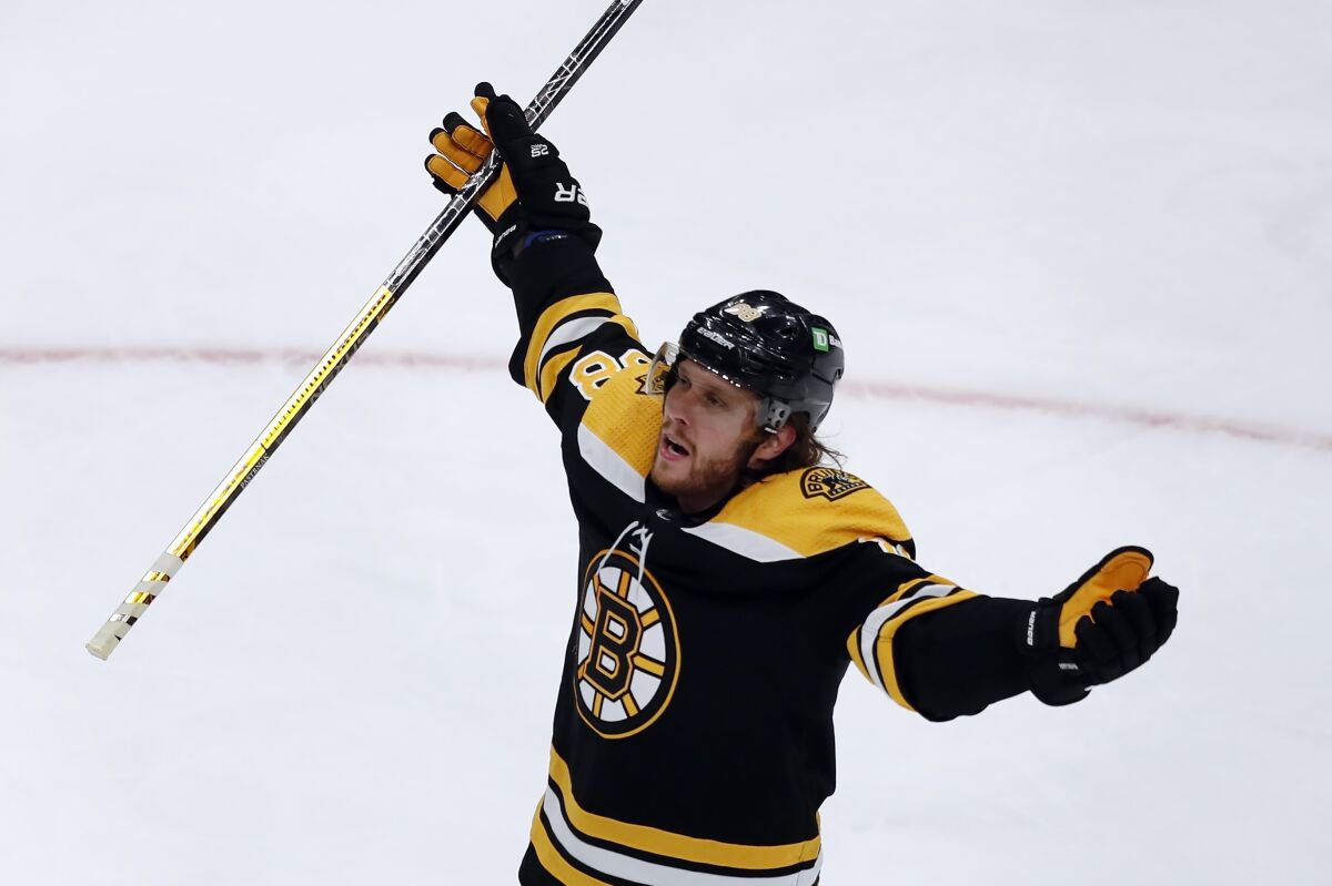 Boston Bruins' David Pastrnak celebrates his goal during the second period of Game 3 of an NHL hockey Stanley Cup first-round playoff series against the Carolina Hurricanes, Friday, May 6, 2022, in Boston. (AP Photo/Michael Dwyer)
