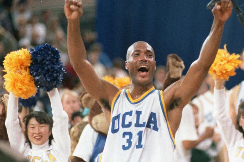 A lawsuit brought by former UCLA basketball player Ed O'Bannon, seen above in 1995, challenged the NCAA rule requiring student athletes to give up any claim to the revenue from television broadcasts, replays, highlight reels, videogames and any other use of their names, images or likenesses. A federal judge has ruled that the NCAA can't stop college football and basketball players from selling the rights to their names and likenesses, opening the way to athletes getting payouts once their college careers are over.