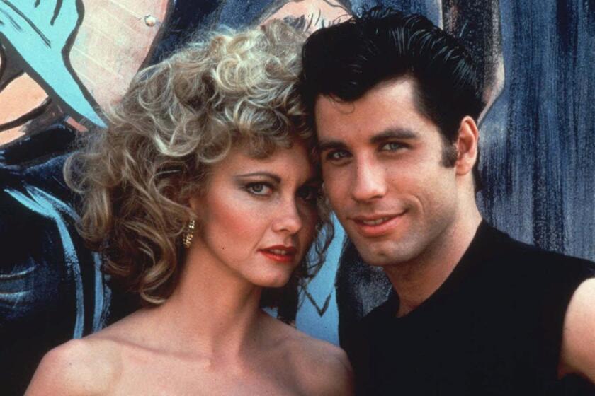ADVANCE FOR WEEKEND EDITIONS, MARCH 27-29--FILE--John Travolta and Olivia Newton-John star in the 1978 film, "Grease," which will be re-released this year to celebrate its 20th anniversary. "Grease" remains ever popular, as indicated by increasing video and record sales. (AP Photo/Paramount) **HOY OUT,MASH OUT** Olivia Newton-John and John Travolta in the 1978 film, "Grease,"