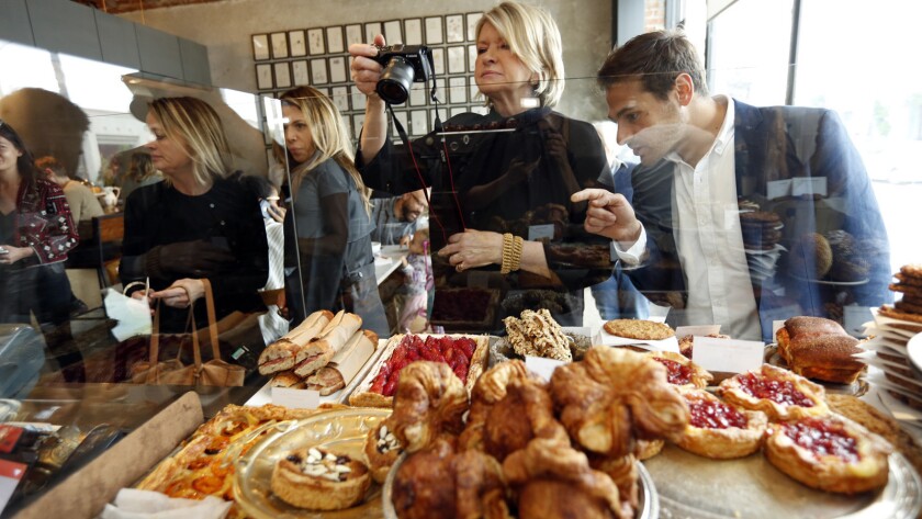 Martha Stewart takes a photo of the pastries at Milo and Olive in Santa Monica.
