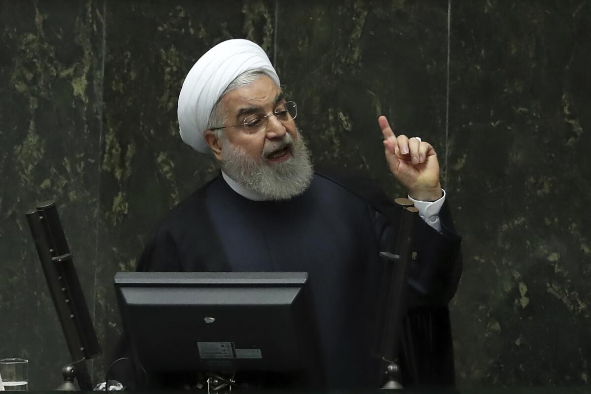 Iranian President Hassan Rouhani speaks at a session of parliament to debate his proposed tourism and education ministers, in Tehran, Iran, Tuesday, Sept. 3, 2019. Rouhani said European nations are failing to implement their commitments following the U.S. pullout from the 2015 nuclear deal with Tehran. (AP Photo/Vahid Salemi)